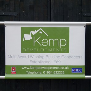 Small scaffold banner with pole pockets